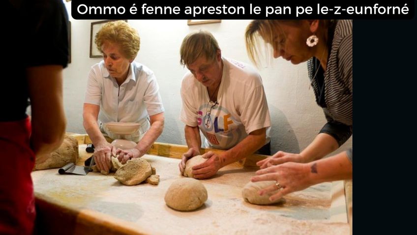 Hommes et femmes préparent les pains pour les mettre dans le four